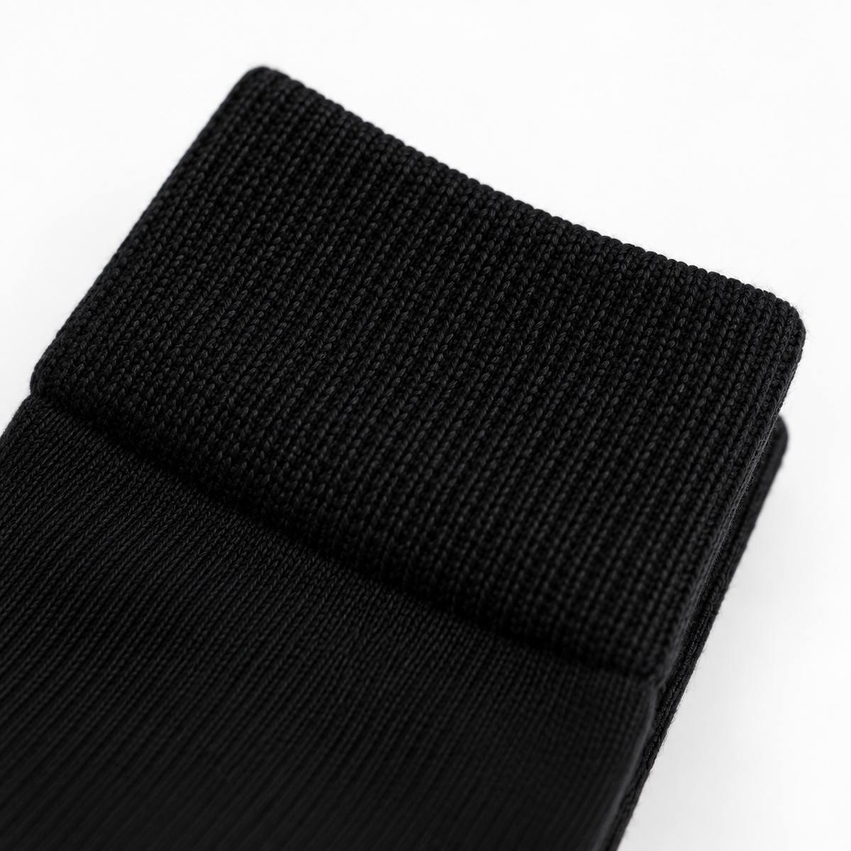 Close-up of the ribbed cuff on an Onyx black business sock