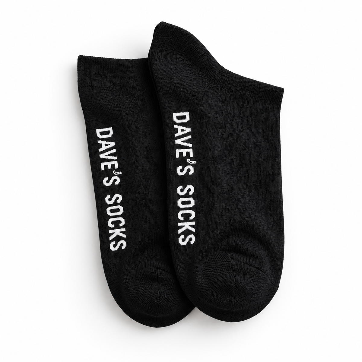 Folded pair of Onyx black business socks with white logos